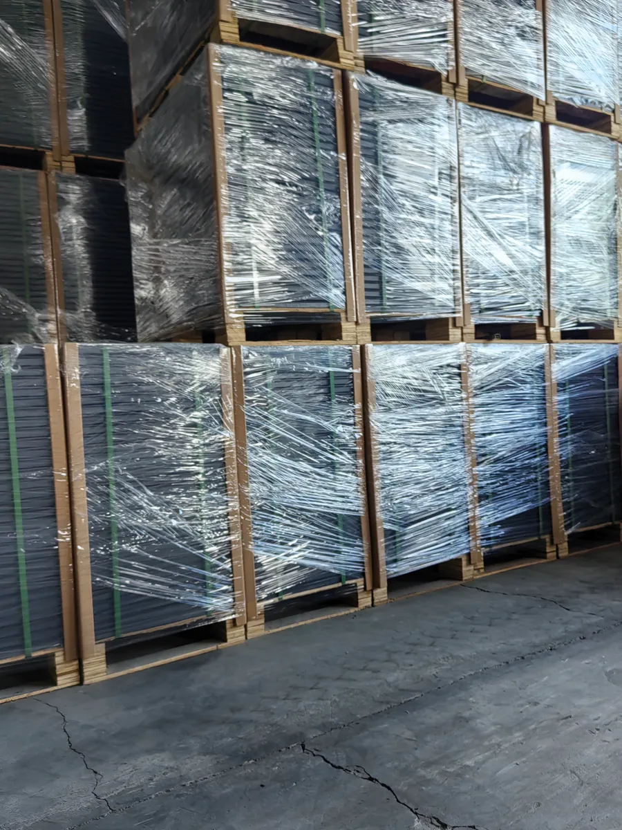 Wrapped steel raised floor pallets with straps and timber framing